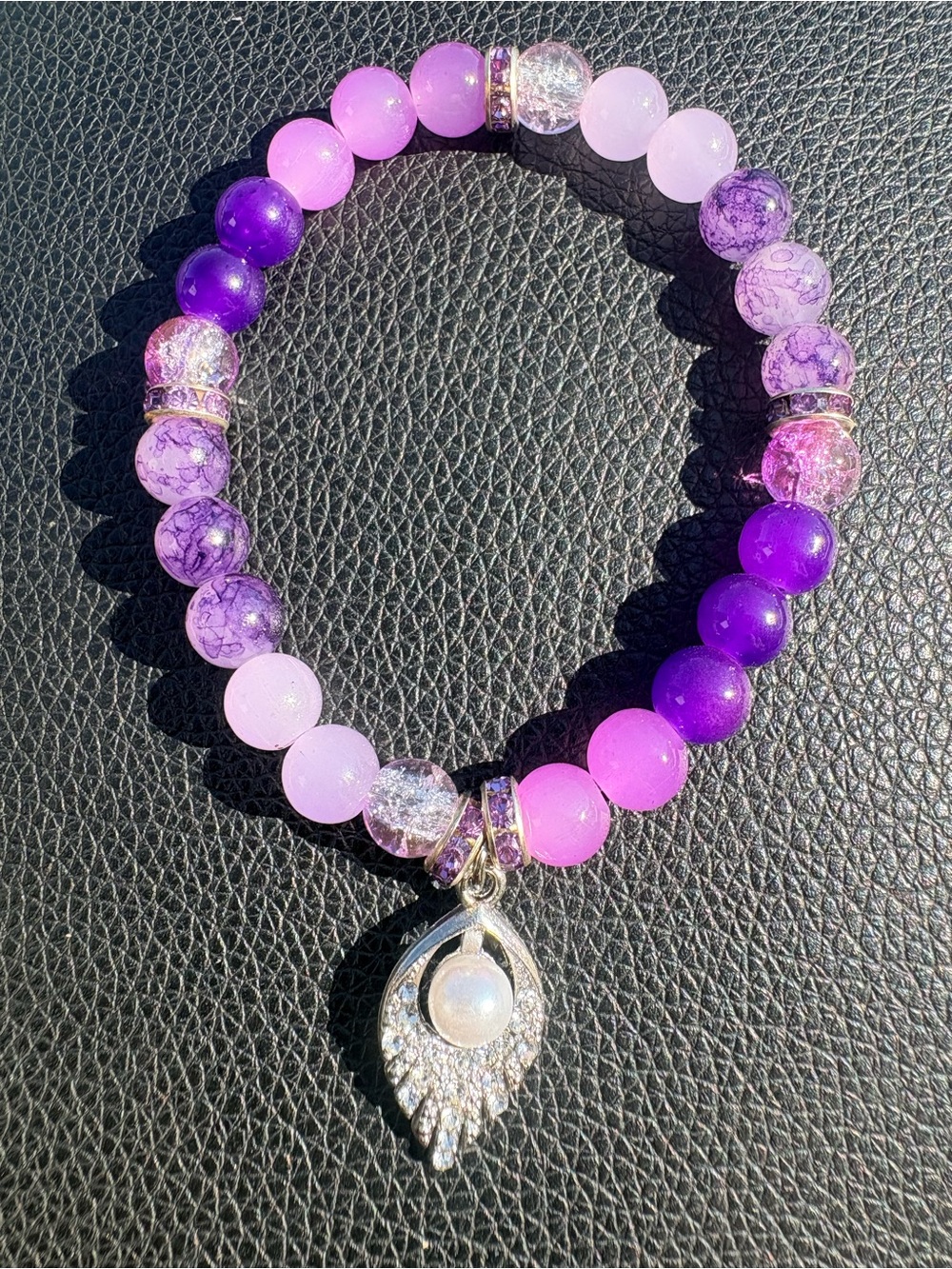 Purple glass beaded bracelet with silver accents and pearl charm
